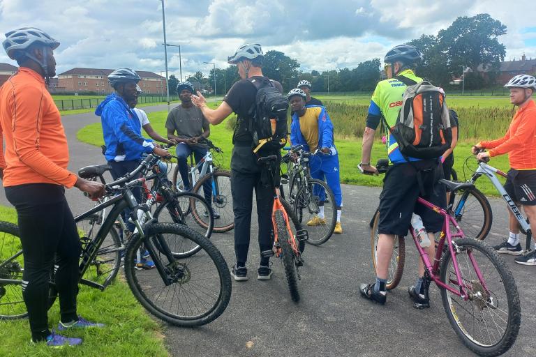 Group of adults on bikes