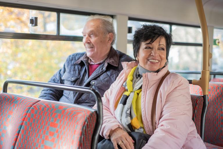 Two people travelling on a bus