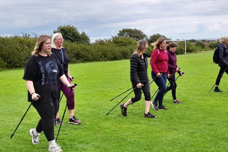 A group of ladies in a Nordic Walk class