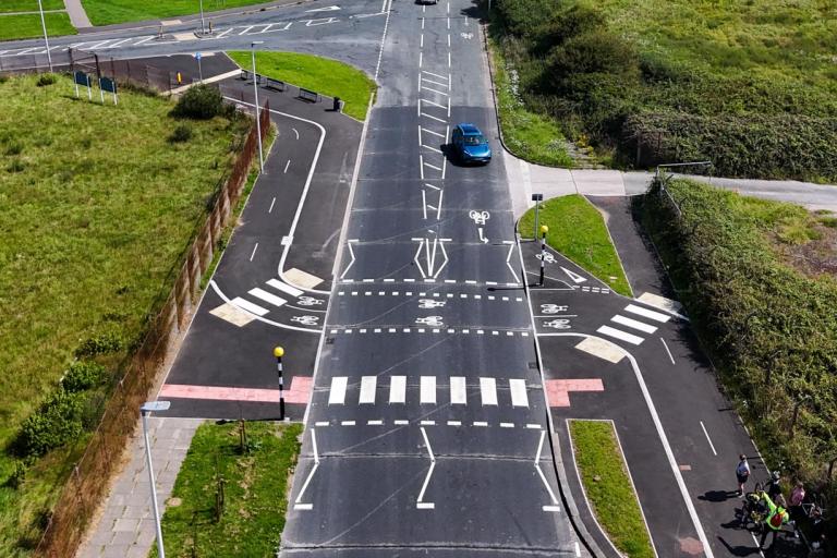An aerial view of a parallel crossing with zebra crossing adjacent to a cycle crossing