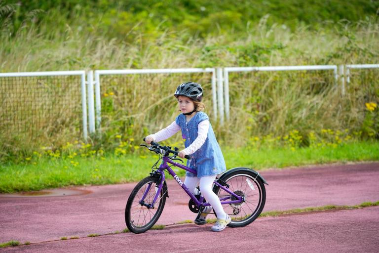 a young girl cycling